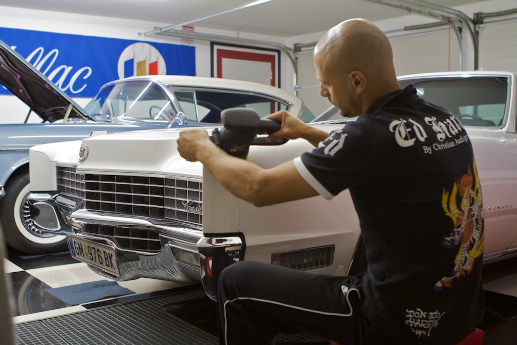 Tayfun polishing the paint of the 1967 Cadillac Eldorado