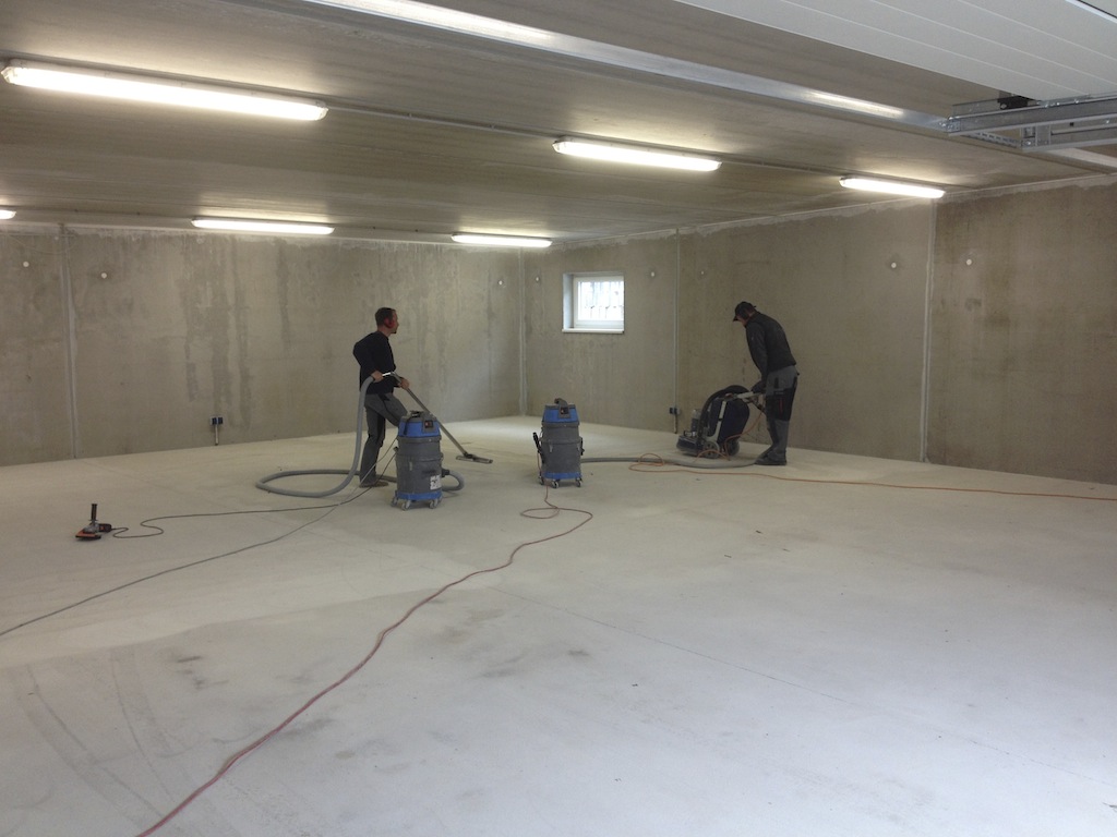 sanding the screed for the epoxy coating...